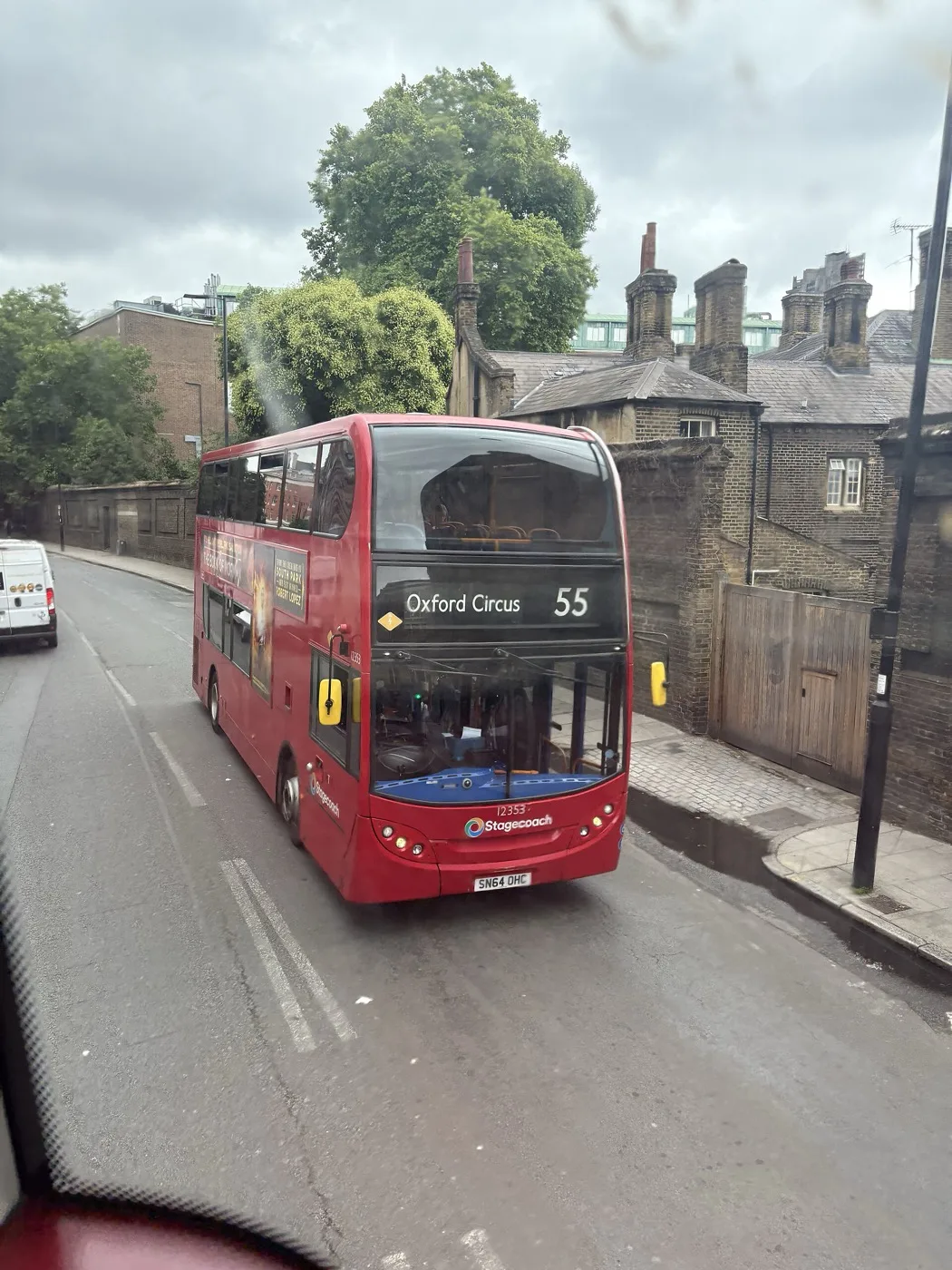 A red double-decker bus on a London street